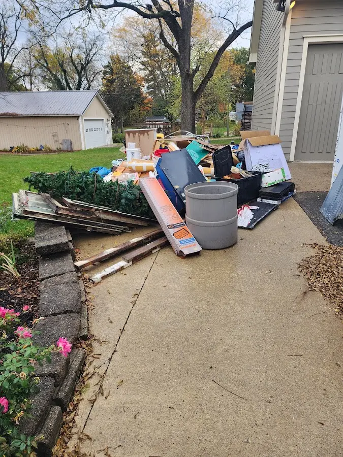 Dumpster being loaded with debris for 10 Yard Dumpster Rental in Glendora
